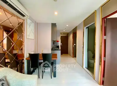 Modern open-plan living and dining area with stylish decor and ample natural light.