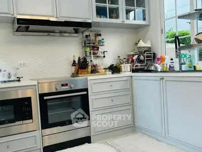 Modern kitchen with sleek appliances and ample storage space