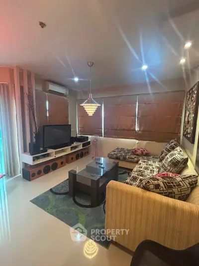 Stylish living room with modern decor and cozy seating area, perfect for relaxation and entertainment.