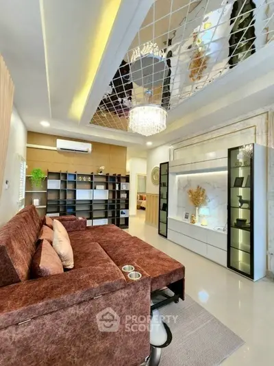 Luxurious living room with elegant decor and mirrored ceiling