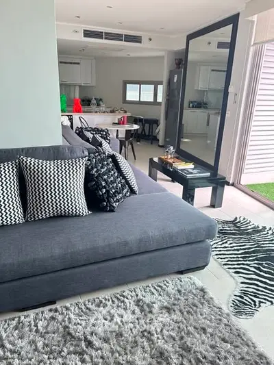 Stylish modern living room with open kitchen and chic decor