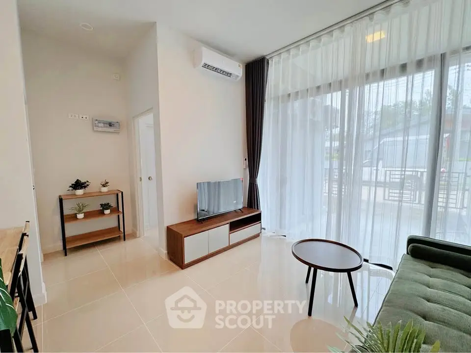 Modern living room with large windows and stylish furniture