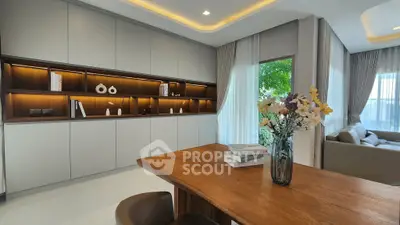 Modern living room with elegant built-in shelves and cozy seating area