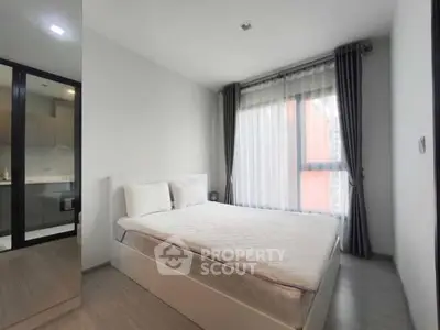 Modern bedroom with large window and minimalist decor