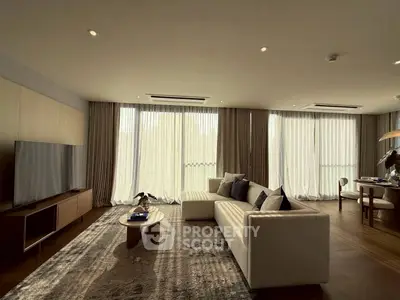 Spacious modern living room with elegant decor and large windows