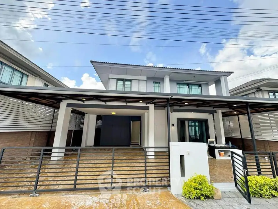 Modern two-story house with spacious driveway and contemporary design