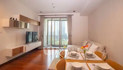 Modern living room with balcony view and elegant dining area