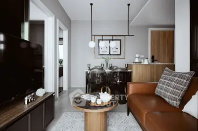 Modern living room with stylish decor and open layout, featuring a cozy seating area and dining space.