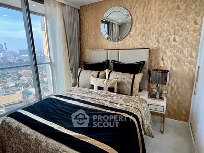 Luxurious bedroom with elegant decor and stunning city view from large window.