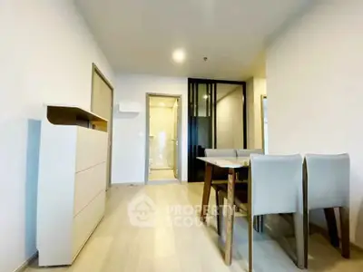 Modern dining area with sleek furniture and minimalist design in a contemporary apartment.