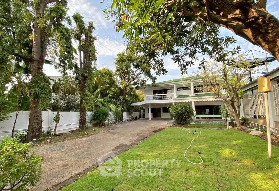 Charming two-story house with lush garden and spacious driveway
