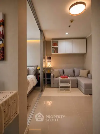 Modern living room with cozy sectional sofa and elegant decor in a stylish apartment.