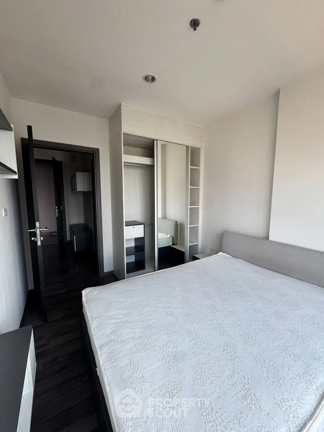 Modern bedroom with sleek wardrobe and minimalist design