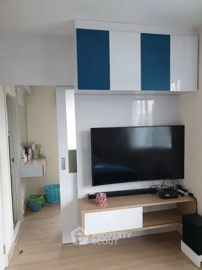 Modern living room with sleek TV unit and stylish storage cabinets
