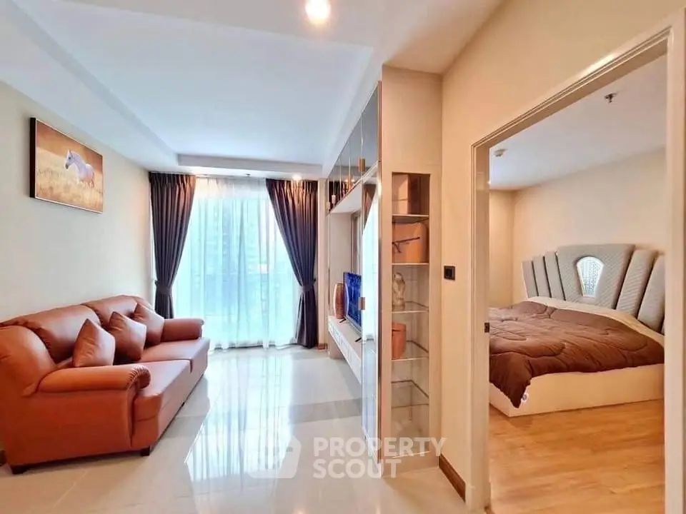 Modern apartment interior with cozy living room and elegant bedroom, featuring stylish furniture and natural light.