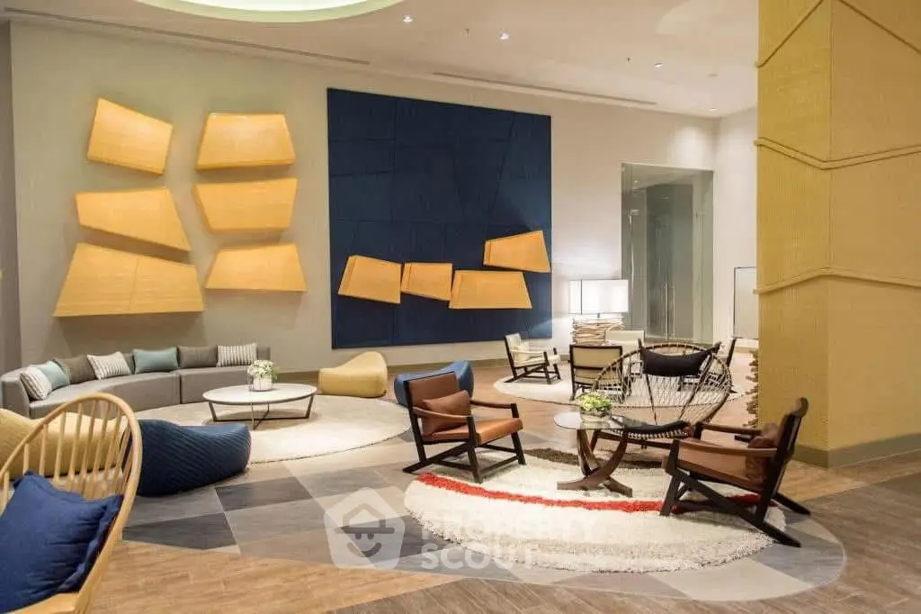 Luxurious modern living room with stylish furniture and artistic wall decor.