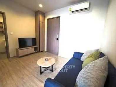 Cozy living room with modern decor and air conditioning