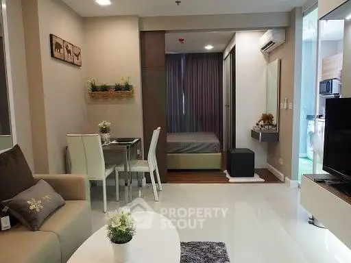 Modern studio apartment with cozy living area and stylish bedroom
