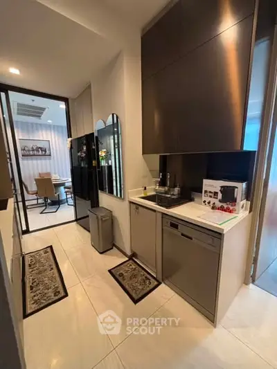 Modern kitchen with sleek cabinetry and dining area view