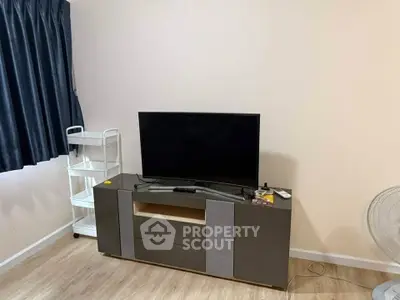 Modern living room with sleek TV stand and minimalist decor