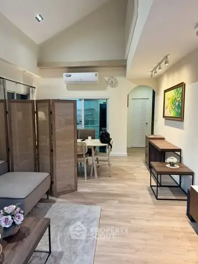 Charming open-plan living area with stylish decor and modern furnishings