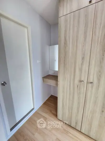 Modern storage space with wooden cabinets and sleek design