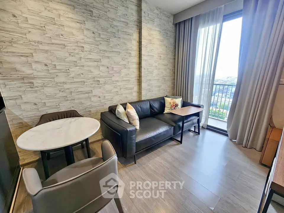 Modern living room with stylish decor and balcony view