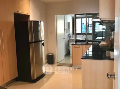 Modern kitchen with sleek appliances and ample storage space