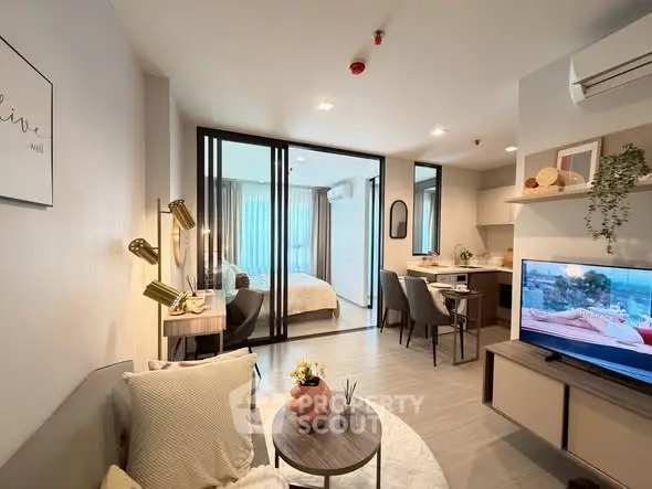 Modern open-plan living room with stylish decor and natural light