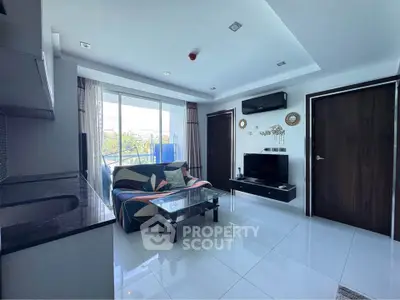 Modern living room with sleek design, large windows, and stylish furniture, offering a bright and inviting atmosphere.