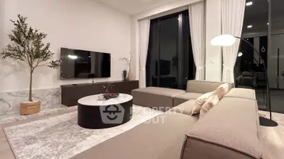 Luxurious modern living room with sleek furniture and elegant decor, perfect for relaxation and entertainment.