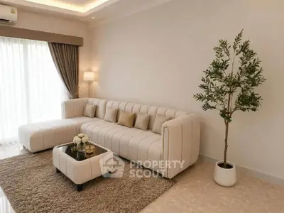 Elegant living room with modern beige sofa and stylish decor