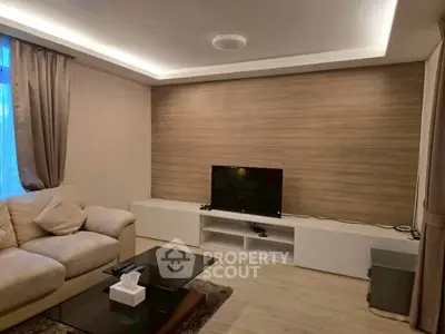 Modern living room with cozy sofa and sleek TV setup
