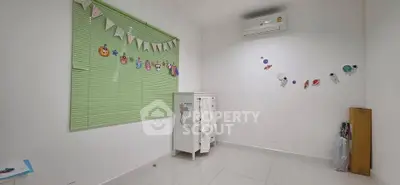 Bright and airy room with playful decor, perfect for a child's bedroom or creative space.
