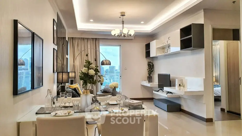 Modern open-plan living and dining area with city view, elegant decor, and stylish lighting.