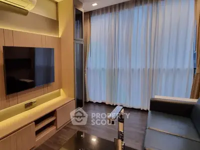 Modern living room with sleek design, featuring a wall-mounted TV and large window with elegant curtains.