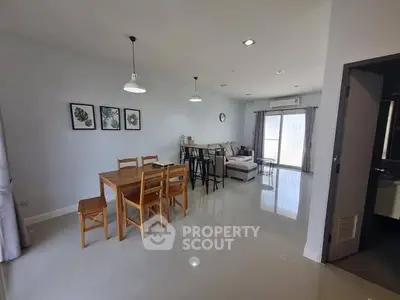 Spacious modern living room with dining area and natural light