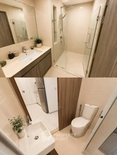 Modern bathroom with glass shower and sleek fixtures in contemporary apartment.