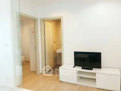 Modern living room with TV and glass partition in stylish apartment