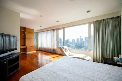 Spacious bedroom with stunning city view and modern furnishings