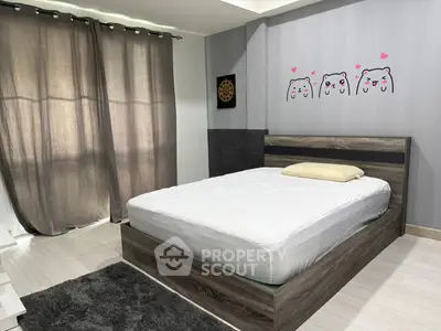 Modern bedroom with stylish decor and natural light