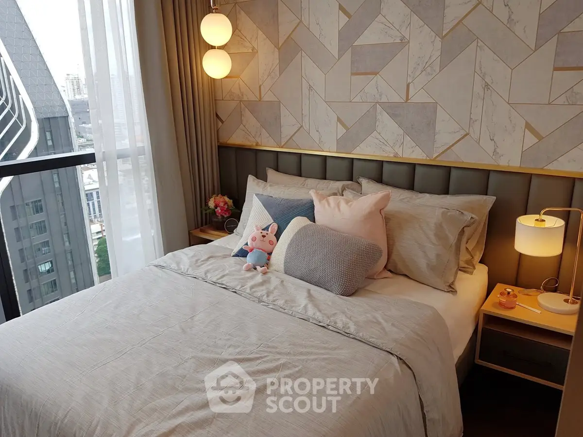 Modern bedroom with stylish decor and city view from window