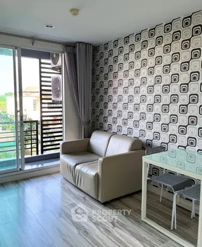 Modern living room with stylish wallpaper and balcony view