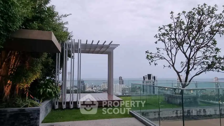 Stunning rooftop garden with panoramic city and ocean views, perfect for relaxation and entertainment.