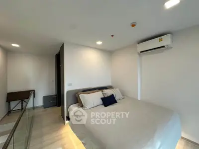 Modern bedroom with air conditioning and minimalist decor in a bright, spacious apartment.