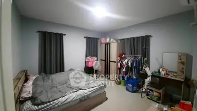 Spacious bedroom with modern decor and ample storage space