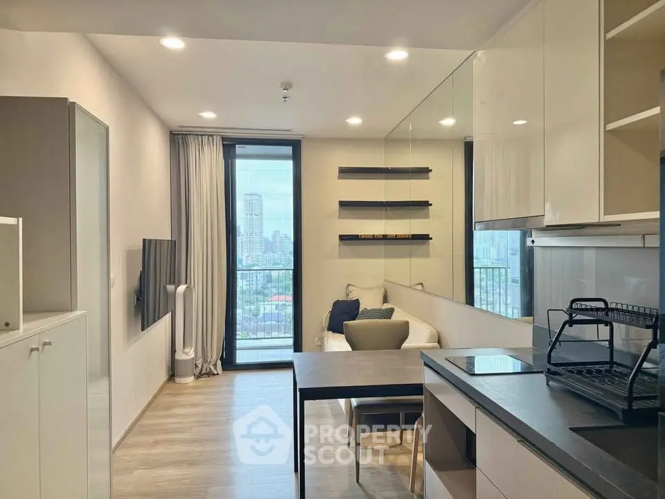 Modern living room with city view, sleek furniture, and open layout.