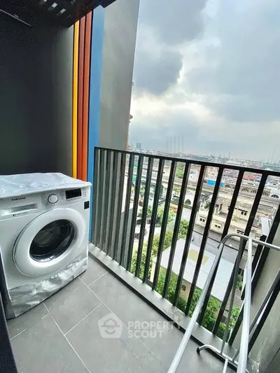 Modern balcony with washing machine and city view, perfect for urban living.