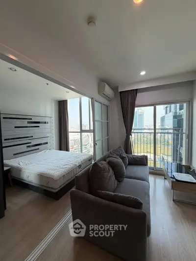 Modern apartment with cozy living room and city view balcony