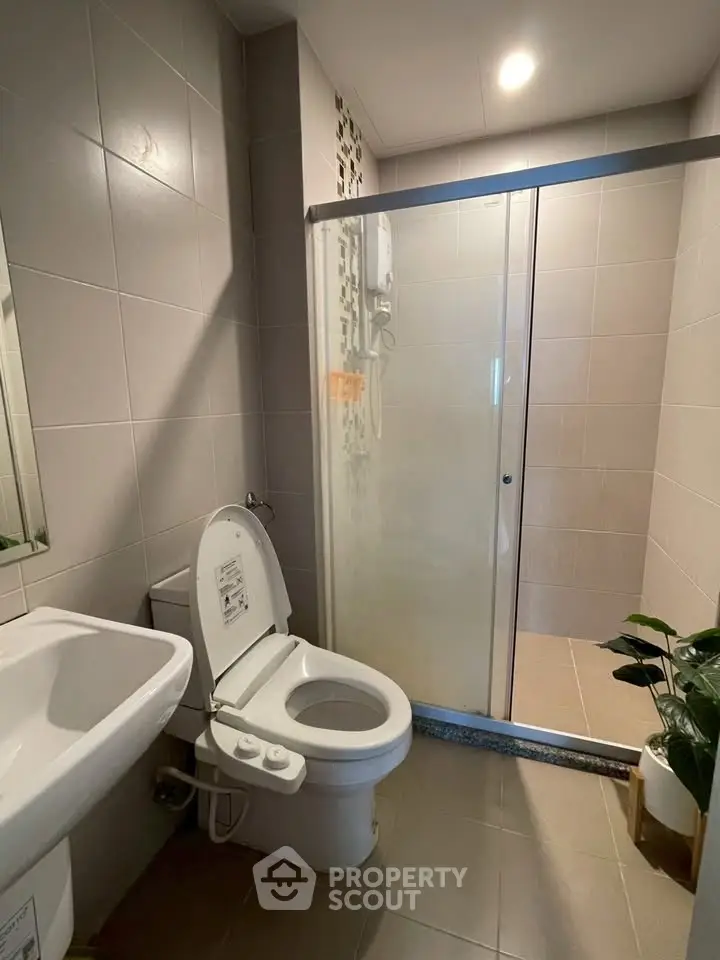 Modern bathroom with glass shower and sleek fixtures